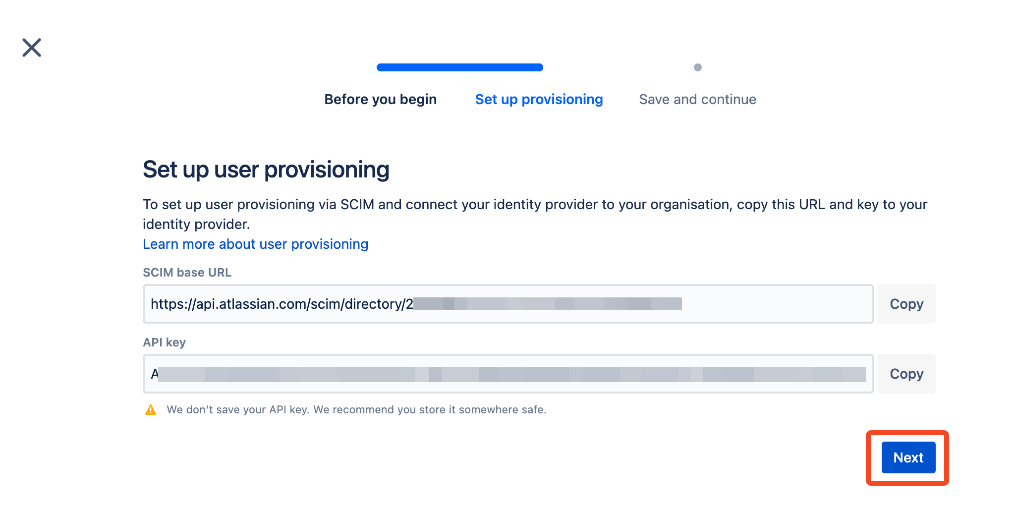 Atlassian SCIM provisioning setup showing the base URL and API key